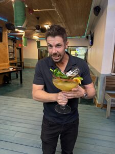 Forrest holding a giant margarita